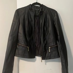 Black leather jacket with gold zippers.